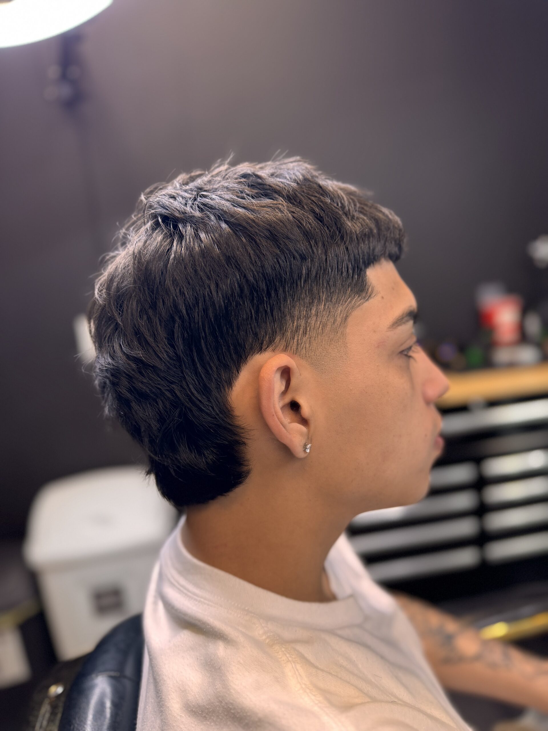 Person with stylish short haircut.