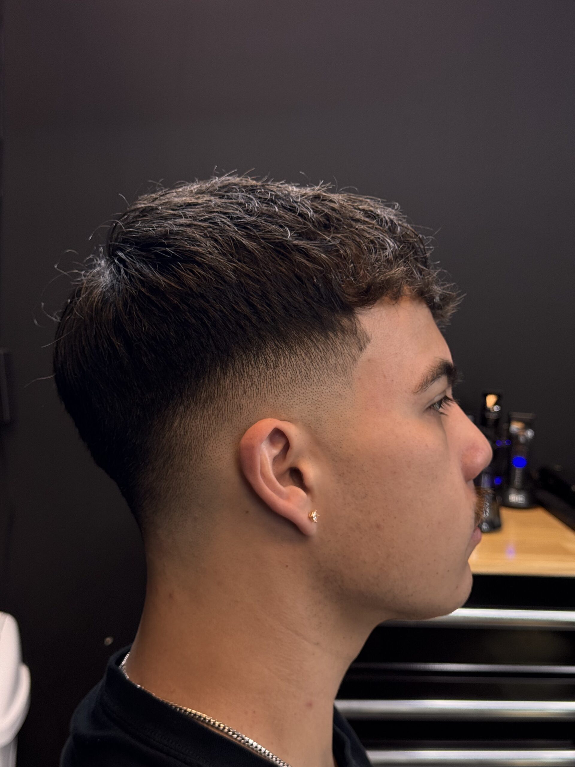 Short hairstyle with faded sides